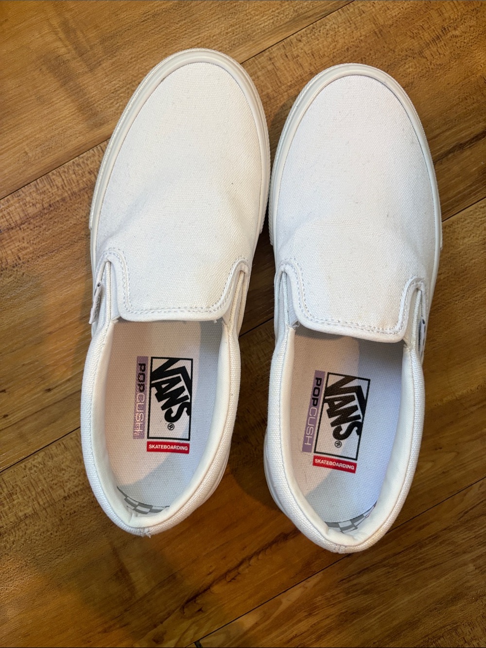 Vans White Canvas Slip-On Sneakers